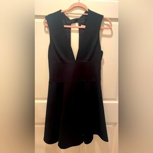 Halston black cocktail dress plunge neck.  Size 8.